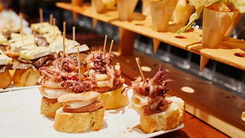 Encrier/Getty Images Pintxos bars in San Sebastian and Bilbao serve up flame-kissed bites using local ingredients (Credit: Encrier/Getty Images)