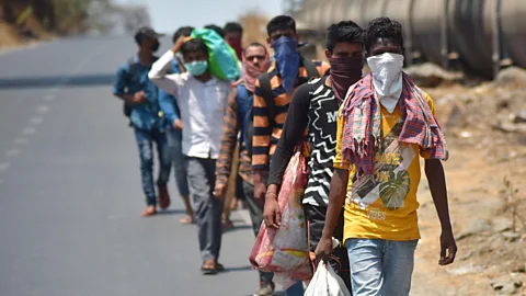 Alamy When the lockdown was announced migrant workers left the cities in droves to return to their home towns - many forced to travel by foot (credit: Alamy)