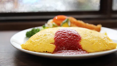 piyato/Getty Images Omurice is an omelette stuffed with rice and served with ketchup (Credit: piyato/Getty Images)