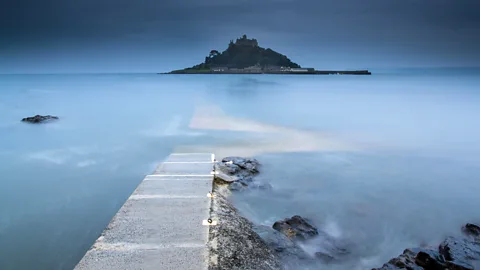 Alamy Human activities that meddle with natural coastlines are altering where water can flow and causing tides to shift (Credit: Alamy)