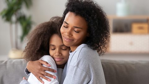 Mum holding daughter