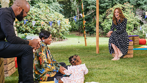 The Princess of Wales laughs while speaking to a family.
