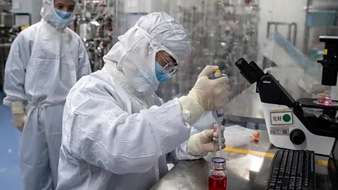 Getty Images A scientist testing a Covid-19 vaccine on some cells (Credit: Getty Images)