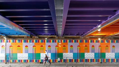 Luke O’Donovan Yinka Ilori’s Happy Street permanent installation has transformed a London railway bridge (Credit: Luke O’Donovan)