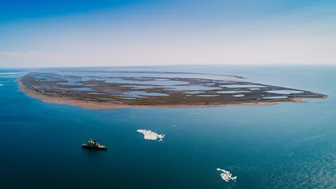 Getty Images The retreating of Arctic sea ice as the climate warms opens up the possibility of new shipping lanes (Credit: Getty Images)