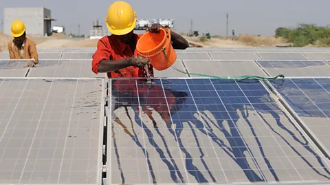 Getty Images Like conventional solar panels, those above canals also require frequent washing to ensure their capacity isn't reduced by dust (Credit: Getty Images)