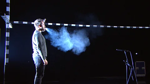 Bayerischer Rundfunk Aerosols and droplets travel furthest when coughing or sneezing, but we still produce them when singing, speaking or even just breathing (Credit: Bayerischer Rundfunk)