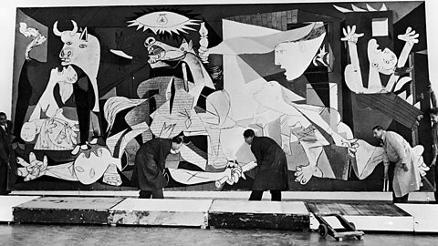 Picasso’s huge Cubist piece ‘Guernica’  being hung in an Amsterdam gallery.