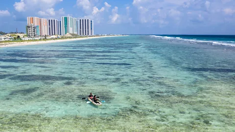 Carl Court/Getty Images At current predicted rates of sea level rise, all of the Maldives’ around 200 natural inhabited islands could be submerged by 2100 (Credit: Carl Court/Getty Images)