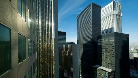 Alamy The high-rise buildings on Toronto's Bay Street that usually bustle with thousands of workers now sit mostly empty – meaning few customers for the shops below (Credit: Alamy)
