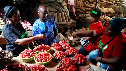 Reuters A market in Lagos, Nigeria, where Pidgin English helps people communicate with a common language (Credit: Reuters)