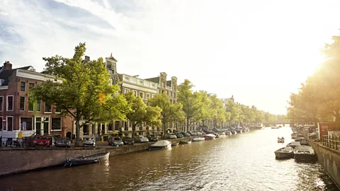 James O'Neil/Getty Images Today, fishing on Amsterdam’s canals is more about environmental awareness than angling (Credit: James O'Neil/Getty Images)