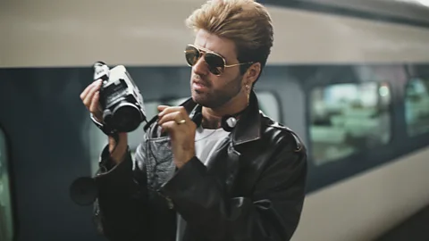 Getty Images For his first solo album Faith, Michael adopted a performatively macho image complete with aviators and leather jacket (Credit: Getty Images)