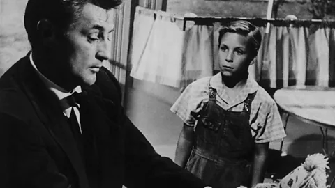 Alamy 1955’s The Night of the Hunter, starring Robert Mitchum as a very bad preacher, is a classic of the Southern Gothic genre (Credit: Alamy)