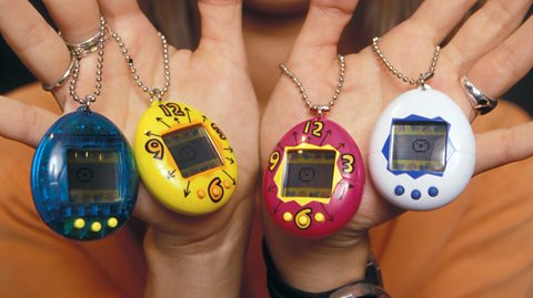 Four different models of Tamagotchi.