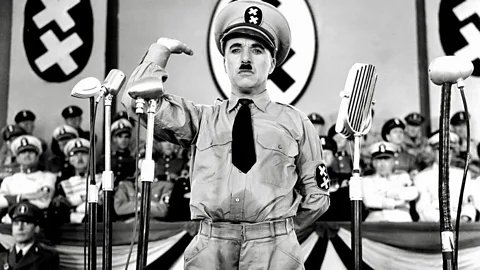 Alamy The history of comic representations of Hitler stretches back to 1940's The Great Dictator, starring Charlie Chaplin as thinly-veiled Führer figure Adenoid Hynke (Credit: Alamy)