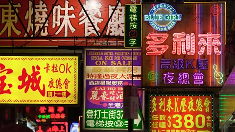 Alamy Love hotels are advertised in neon lights on Nathan Road (Credit: Alamy)