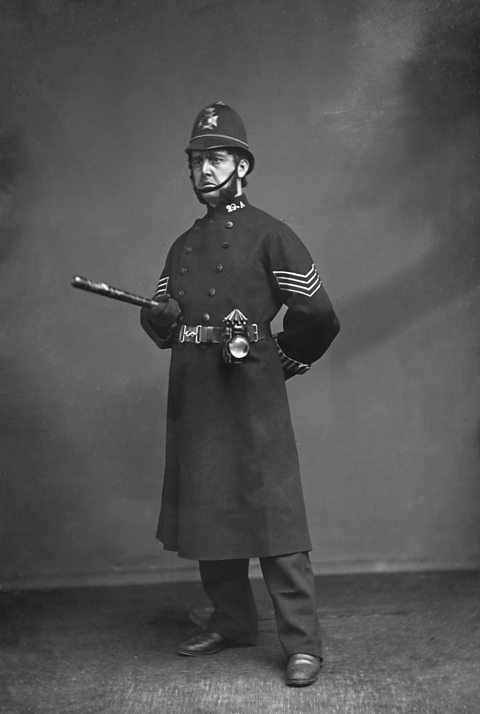 1880, a Police man in the traditional  uniform of the Victorian period.