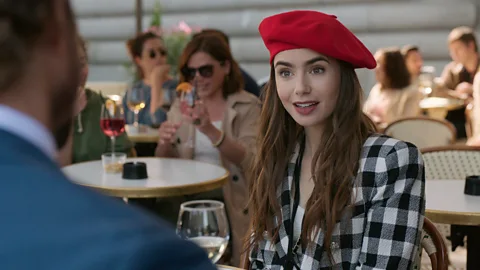 Netflix Netflix’s Emily in Paris focuses on a young American who moves to the French capital and lives out her romantic fantasy – aggressive red beret and all (Credit: Netflix)