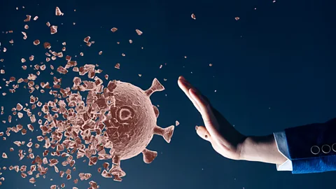 Getty Images Person stopping flu virus (Credit: Getty Images)