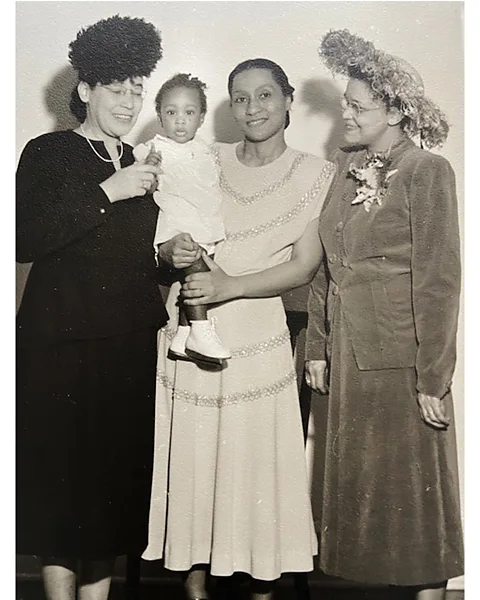 Courtesy of Helen Jayne Brown Dickens holds her daughter Helen Jayne Brown, with her mentor Virginia Alexander (left) and friend Sadie Alexander (right) (Credit: Courtesy of Helen Jayne Brown)