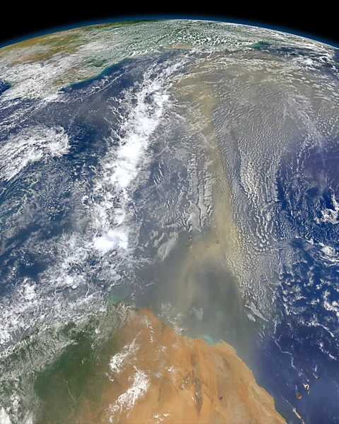 Nasa Strong dry winds and dust from the Sahara can dampen the strength of storms and may even influence their direction (Credit: Nasa)