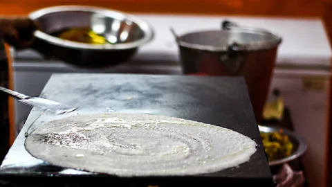 Anindam Ghosh/EyeEm/Getty Images Dosai is a thin South Indian pancake made from a fermented batter of soaked rice and black gram (Credit: Anindam Ghosh/EyeEm/Getty Images)