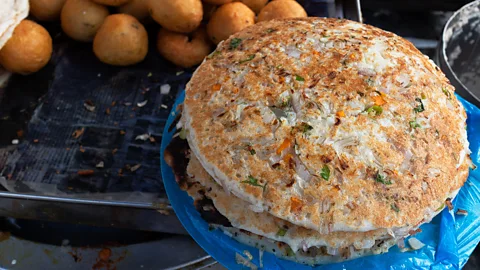 Sanjay Borra/Alamy Uthappam is a thicker type of dosai made with chopped or sliced vegetables (Credit: Sanjay Borra/Alamy)