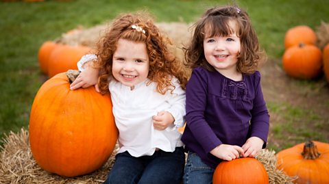 Girls at a pumpkin patch