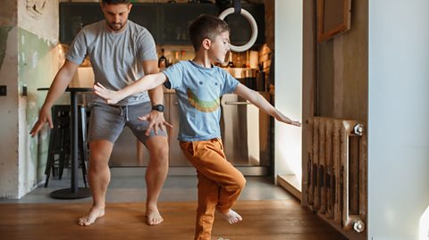 Boy and dad exercising