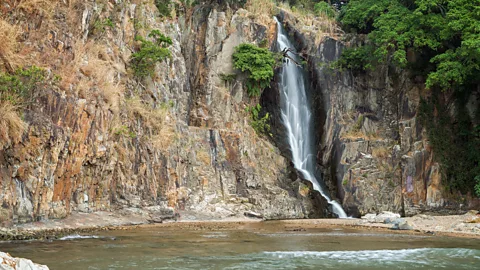 Tuomas Lehtinen/Getty Images Waterfall Bay Park's cascade (known locally as "Heung gong") is said to have given Hong Kong its name (Credit: Tuomas Lehtinen/Getty Images)