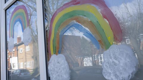 A rainbow painted on a window.