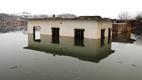 Getty Images The waters came slowly, but by February they were taking Hasankeyf buildings old and new (Credit: Getty Images)