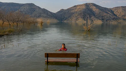 Getty Images In August, a girl swims in risen waters. The reservoir, when full, will cover more than 300 sq km (116 sq miles) of land (Credit: Getty Images)