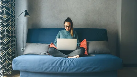 File image of a young woman working at home