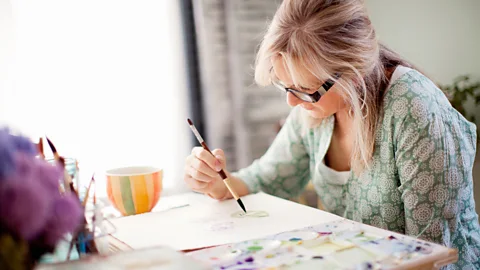 Alamy Experts suggest that to deal with uncertainty, lose yourself in activities that require all your concentration, like painting or playing with puzzles