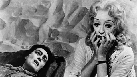 Getty Images Psychological horror What Ever Happened to Baby Jane? follows an ageing actress (Davis) holding her paraplegic sister (Crawford) captive in a mansion (Credit: Getty Images)