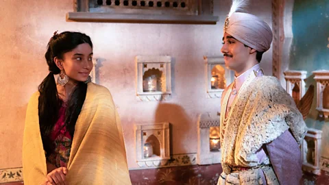 FX The new TV version makes one important change from the film, in casting ethnically appropriate actors, including Dipika Kunwar (left) and Chaneil Kular (right) (Credit: FX)