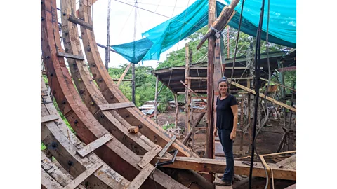 Jocelyn Timperley Danielle Doggett, Sail Cargo's co-founder and managing director, inspects the progress of Ceiba's construction from inside the hull (Credit: Jocelyn Timperley)