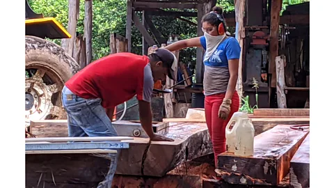 Jocelyn Timperley Locals such as Jamilet Espino Castillo (right) have found opportunities to learn new skills on the shipyard – such as carpentry (Credit: Jocelyn Timperley)