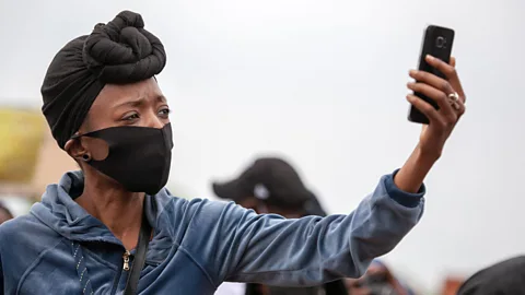 Alamy activist woman with phone