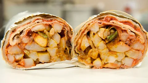 Eric Nathan/Alamy The Gatsby has been re-imagined in various forms, such as this wrapped chicken roti Gatsby (Credit: Eric Nathan/Alamy)