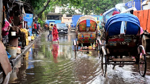 Getty Images Flooding is a regular part of life in Dhaka, but the city is being adapted to survive the more extreme floods of the future (Credit: Getty Images)