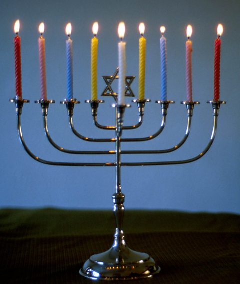 A lit Hanukkiah, a special type of menorah