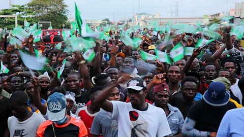 Getty Images The Lekki shooting: In footage shared on social media, shots could be heard as protesters sat down, locked arms and sang the national anthem together (Credit: Getty Images)
