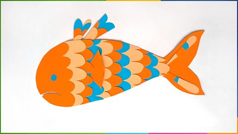 A paper fish with scallop pattern