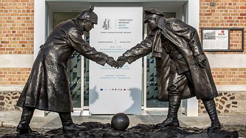 Statue by Andrew Edwards representing British and German soldiers shaking hands during World War One Christmas Truce