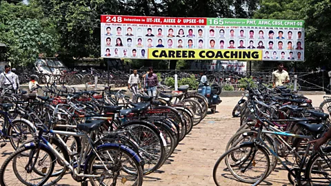 Alamy A busy coaching centre in the city of Lucknow advertises the successes of its former students (Credit: Alamy)