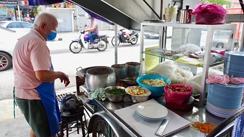 Kirsten Raccuia Many people believe that the secret to Uncle Tan's success is cooking on charcoal (Credit: Kirsten Raccuia)