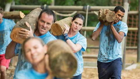 Alamy Some argue that team building can provide the opportunity for teams to experience mutual hardships that could strengthen connections (Credit: Alamy)